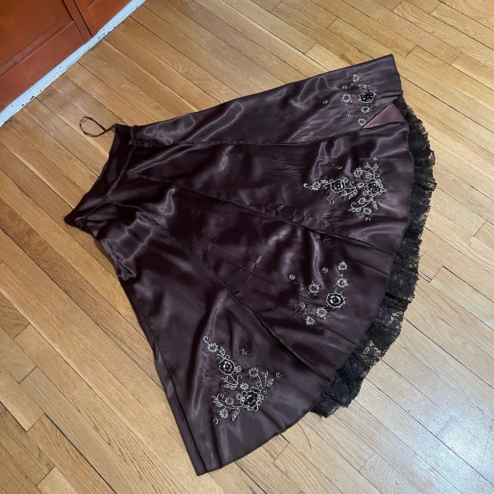Long brown satin skirt.